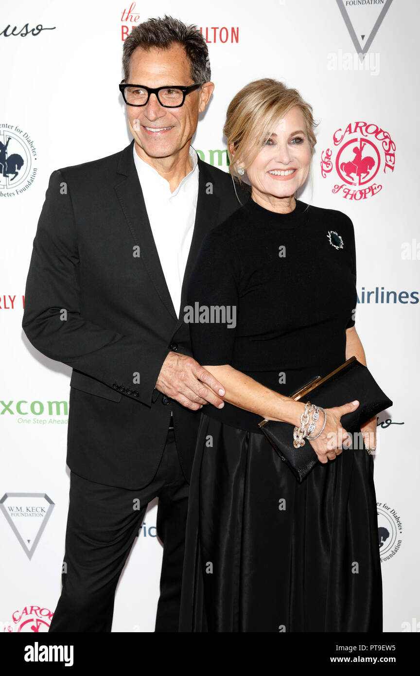 Michael Cummings and his wife Maureen McCormick attending the Carousel