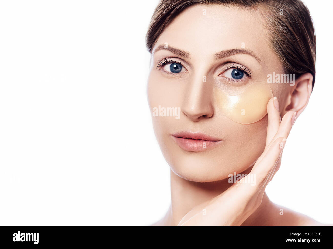 eye patches removing swelling under the eyes Stock Photo