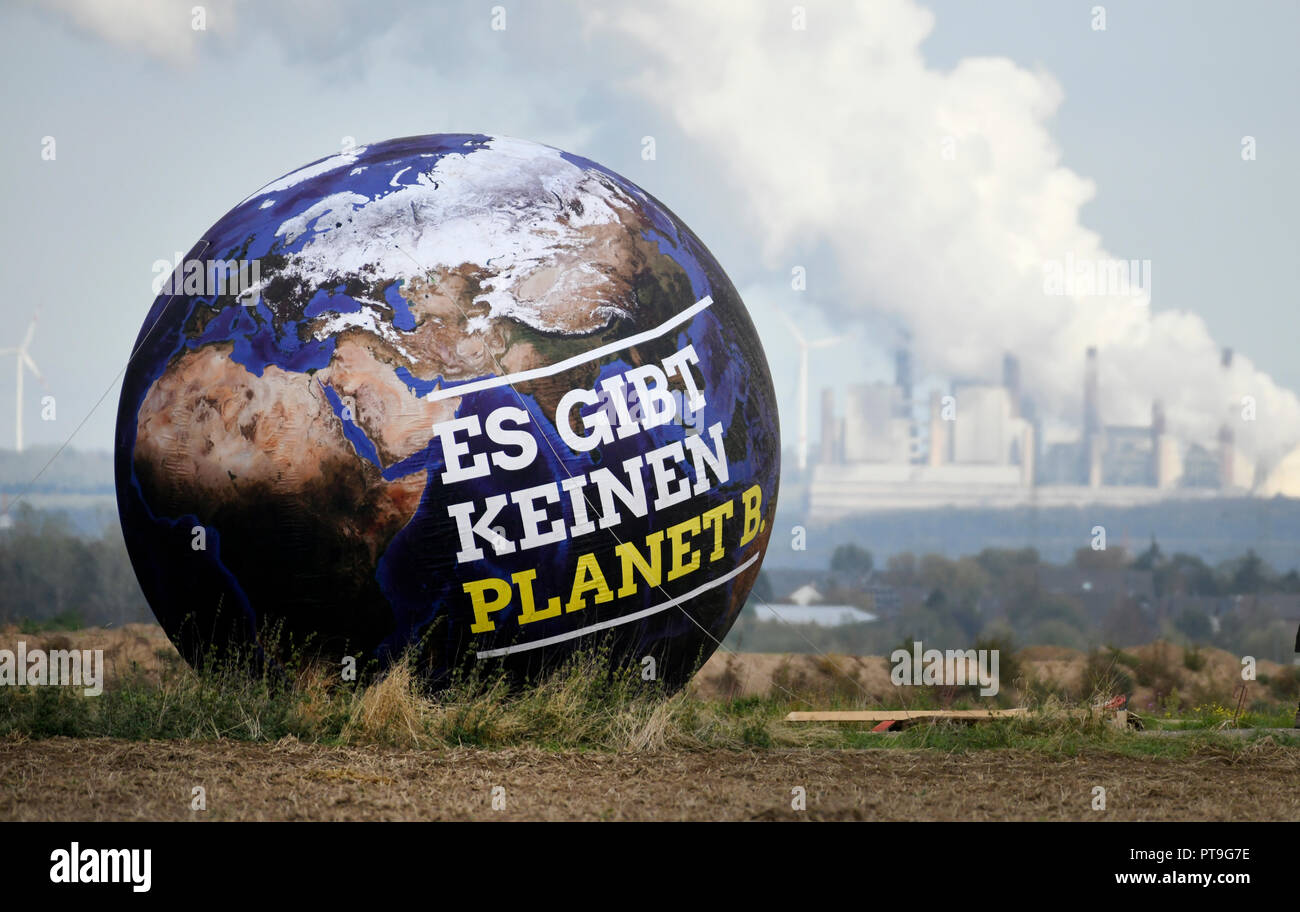 07 October 2018, North Rhine-Westphalia, Kerpen: 07 October 2018, Germany, Kerpen: A balloon with the inscription 'There is no Planet B.' can be seen in front of lignite-fired power plants - taken on the fringes of the North Rhine-Westphalian Green Party Convention, which took place at the Hambach Forest. (to dpa ' Intergovernmental Panel on Climate Change urges rapid action for 1.5 degree target' of 08.10.2018) Photo: Ina Fassbender/dpa Stock Photo