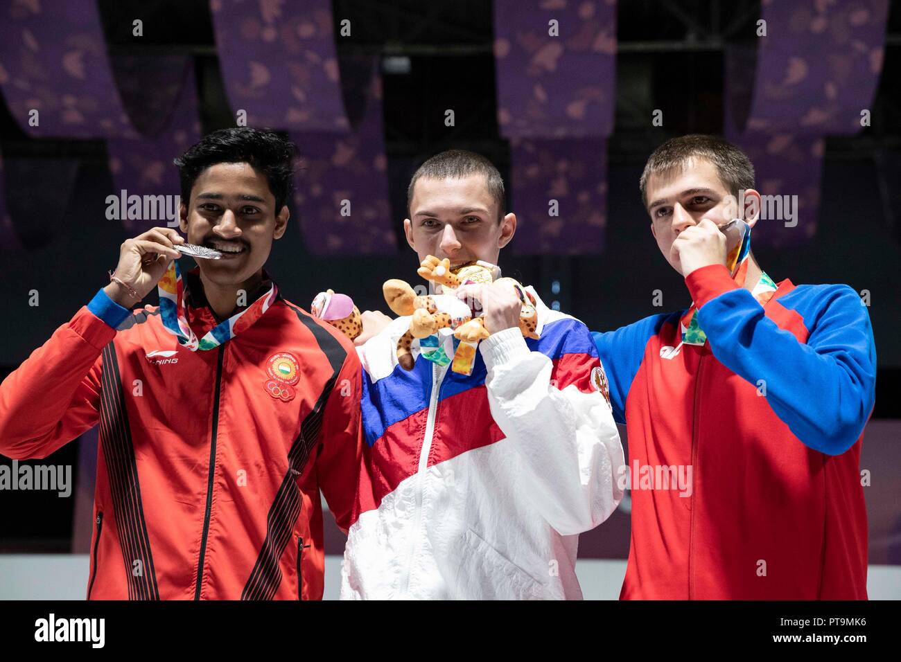 Buenos Aires, Argentina. 7th Oct, 2018. Gold medalist Grigorii Shamakov (C) of Russia, silver medalist Shahu Tushar Mane (L) of India and bronze medalist Aleksa Mitrovic of Serbia pose for photos during the awarding ceremony of the Men's 10m Air Rifle Final at the 2018 Summer Youth Olympic Games in Buenos Aires, capital of Argentina, Oct. 7, 2018. Grigorii Shamakov won the first gold of the games with 249.2 points. Credit: Li Ming/Xinhua/Alamy Live News Stock Photo