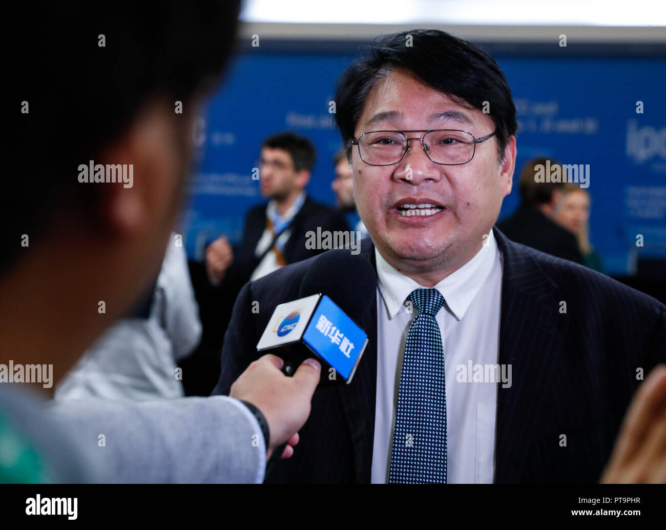 Incheon, IPCC in South Korea's western port city of Incheon. 8th Oct, 2018. Zhai Panmao, co-chair of Intergovernmental Panel on Climate Change (IPCC) Working Group, receives interview after a press conference of the 48th session of IPCC in South Korea's western port city of Incheon, Oct. 8, 2018. The IPCC, an international body assessing the science related to climate change, on Monday urged 'rapid and far-reaching' changes in all aspects of the entire world to fight against global warming after adopting a special report on global warming. Credit: Wang Jingqiang/Xinhua/Alamy Live News Stock Photo