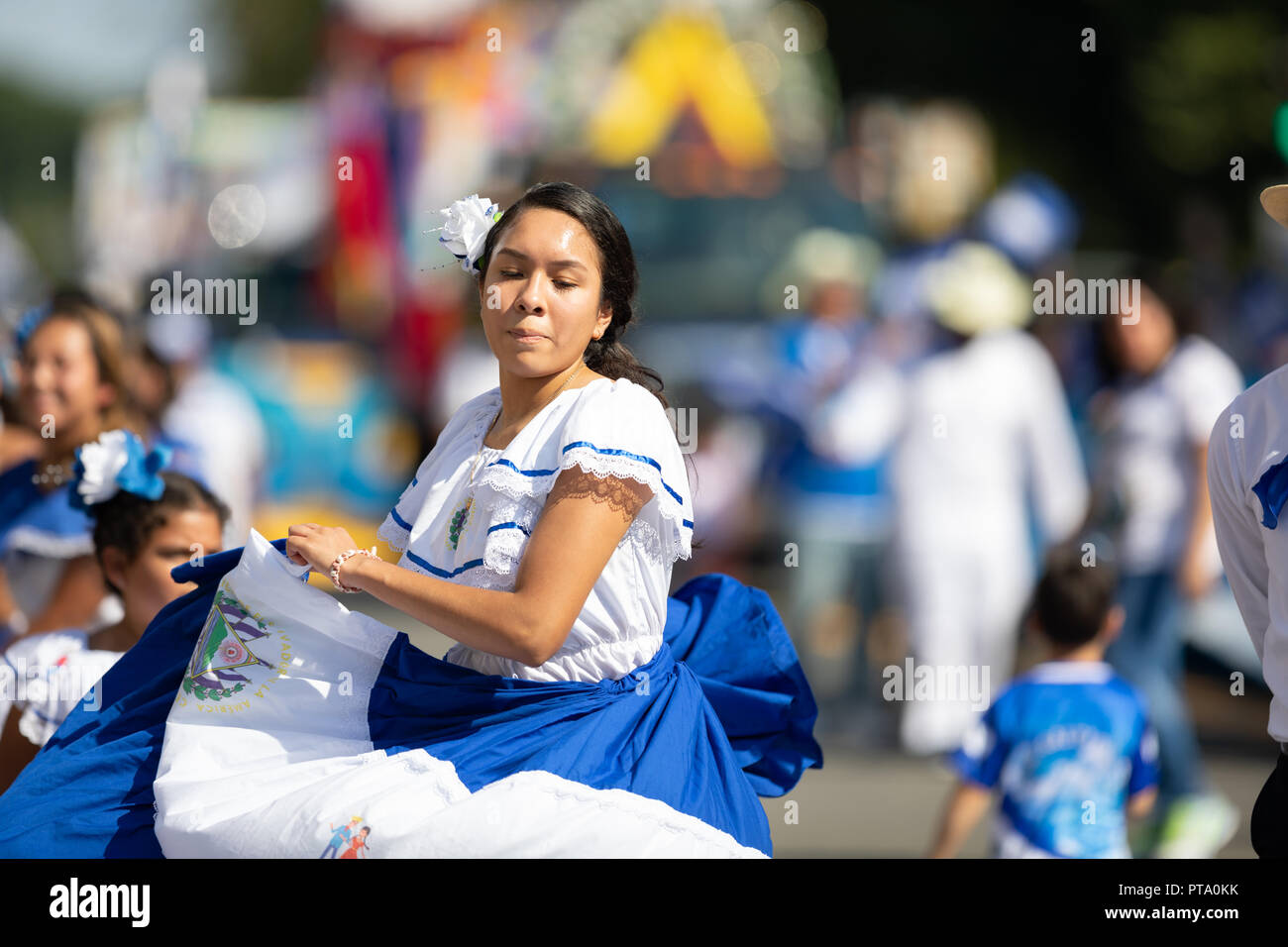 Washington, D.C., USA - September 29, 2018: The Fiesta DC Parade, woman from El Salvador wearing traditional clothing dancing Stock Photo