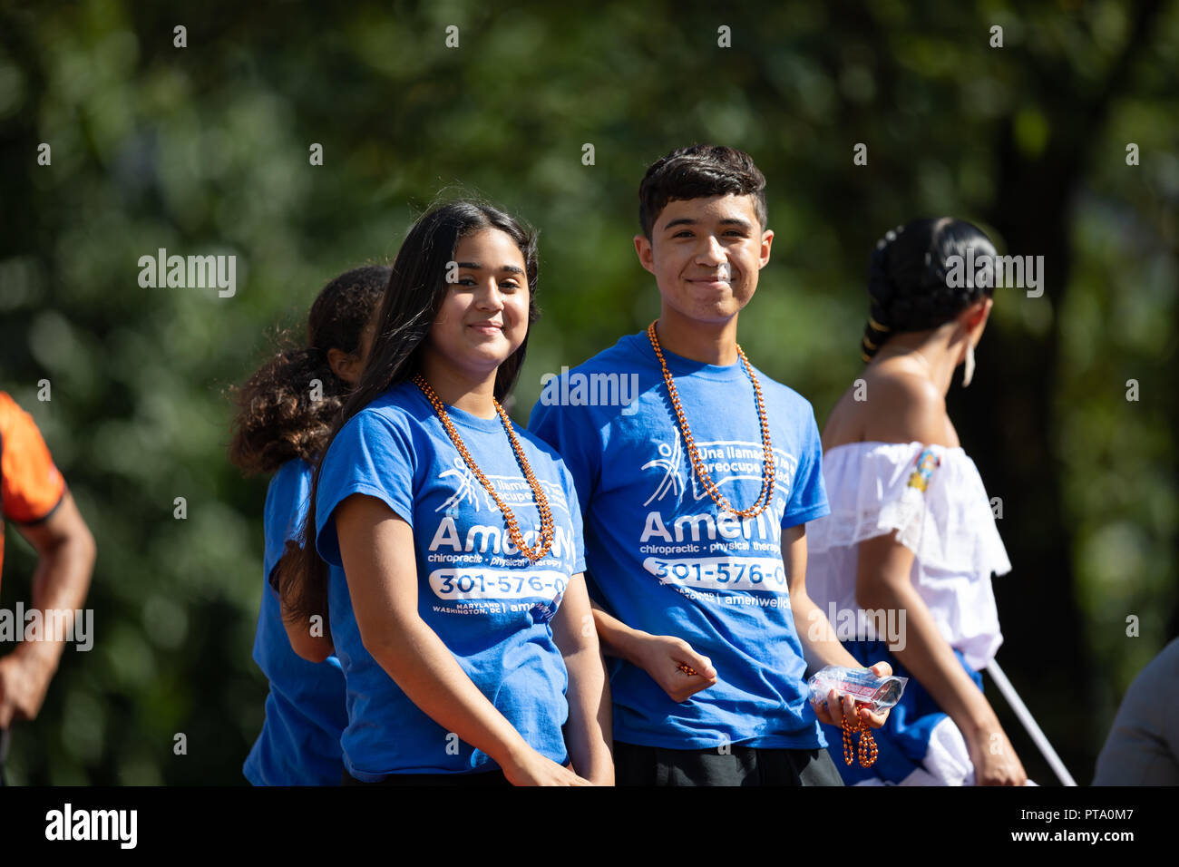 Washington, D.C., USA - September 29, 2018: The Fiesta DC Parade, Young man and woman from el Salvador smile for the camera during the parade Stock Photo