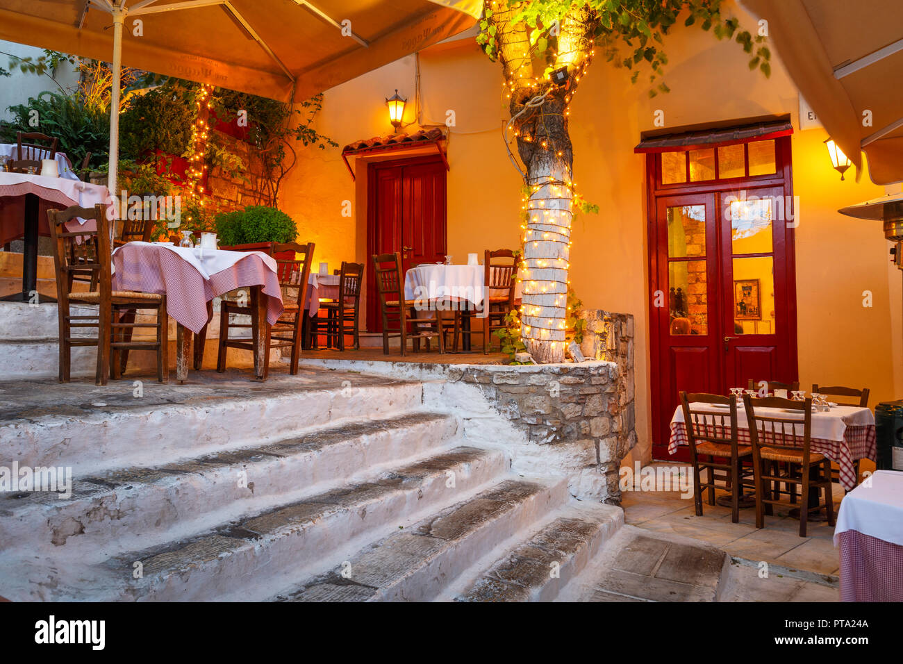 Athens, Greece - September 25, 2018: Taverna in a street of Plaka district in Athens, Greece. Stock Photo