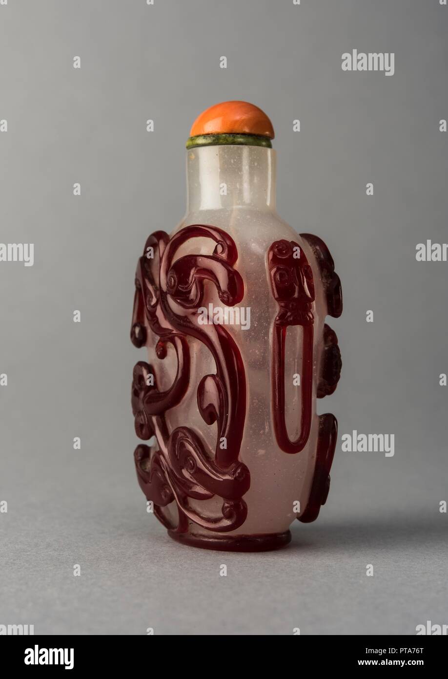 Clear glass snuff bottle with red overlay, China, Qing dynasty, 1644-1911. Creator: Unknown. Stock Photo