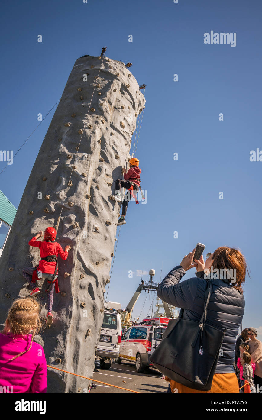 Children climbing, Summer Festival, Seaman's Day, (Sjomannadagurinn) Reykjavik, Iceland Stock Photo