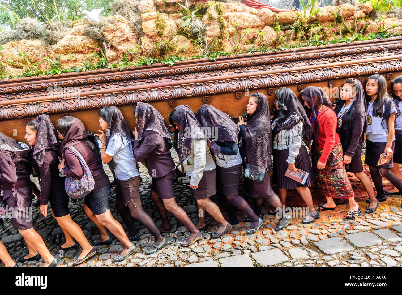 Antigua, Guatemala - April 3, 2015: Good Friday procession in UNESCO World Heritage Site with most famous Holy Week celebrations in Latin America. Stock Photo