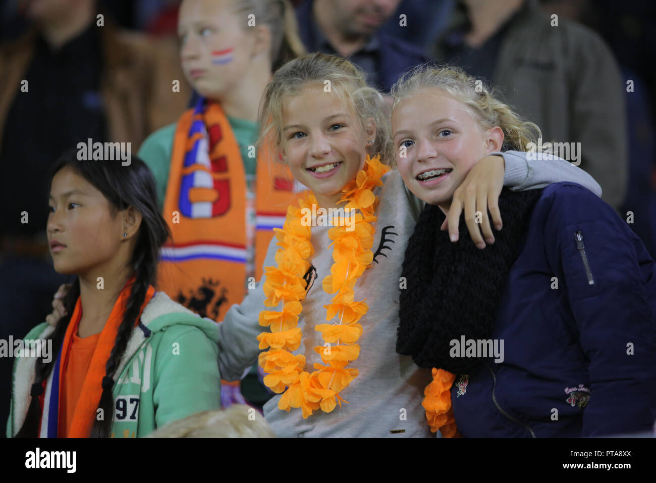 Football fans of Netherlands watch the match agains Denmark for qualification to the world cup. Stock Photo