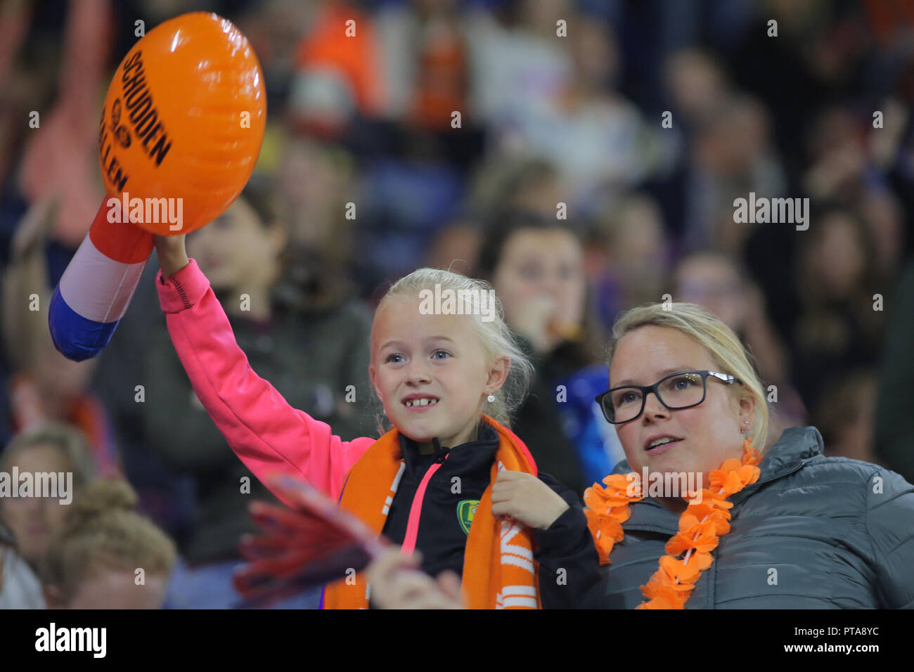 Football fans of Netherlands watch the match agains Denmark for qualification to the world cup. Stock Photo