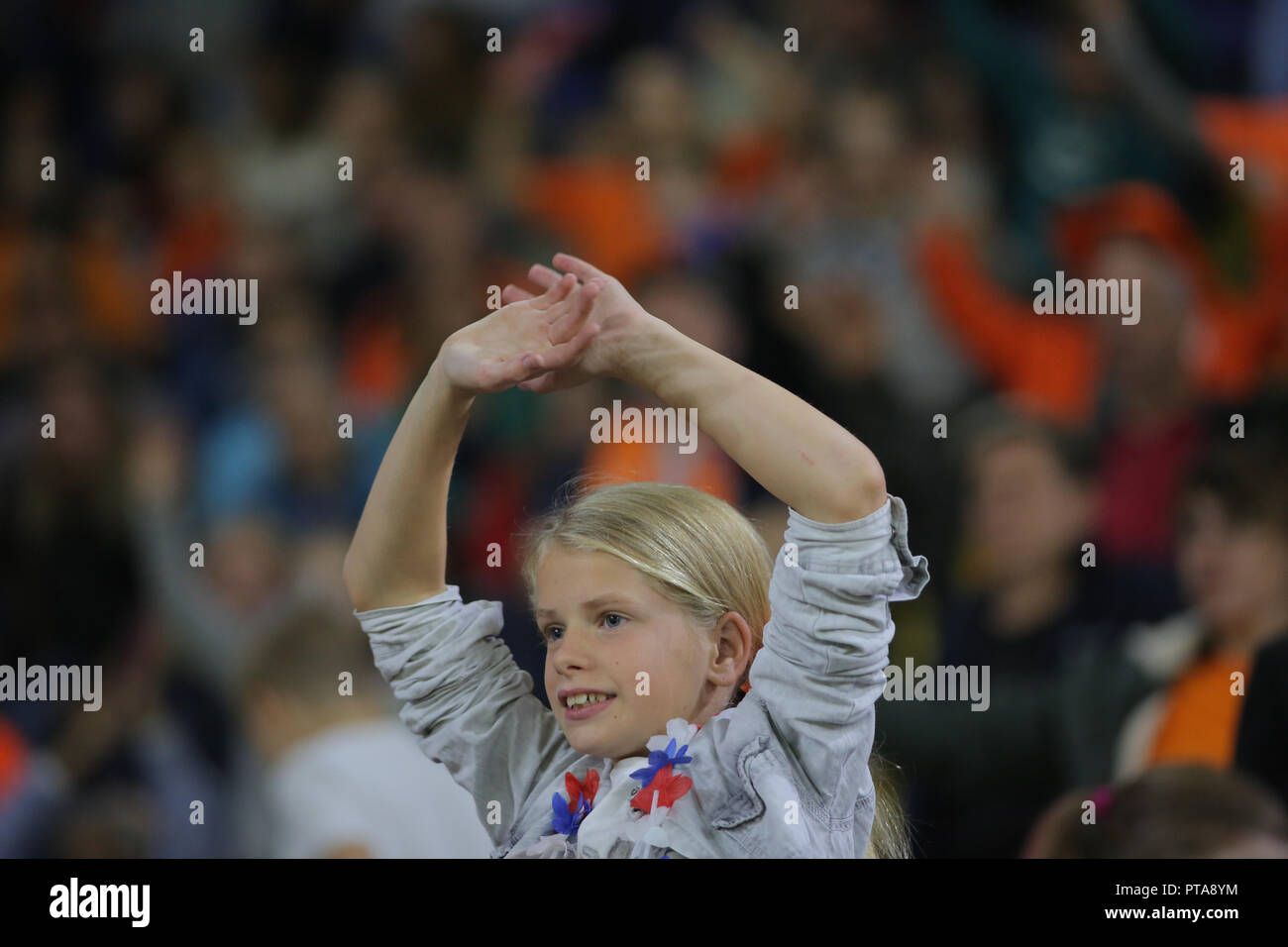Football fan of Netherlands watch the match agains Denmark for qualification to the world cup. Stock Photo