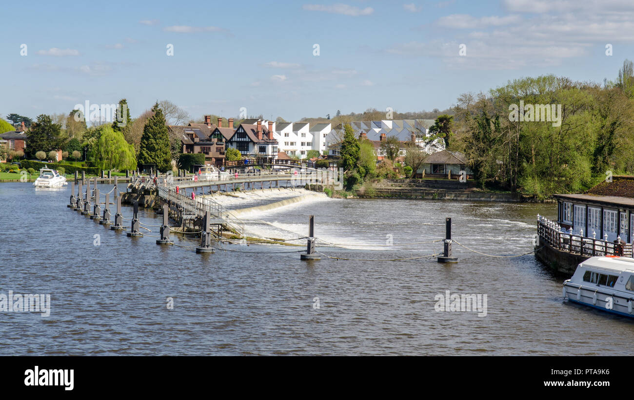 Marlow, England, UK - April 18, 2015: The River Thames flows over a weir at Marlow Lock in Buckinghamshire. Stock Photo