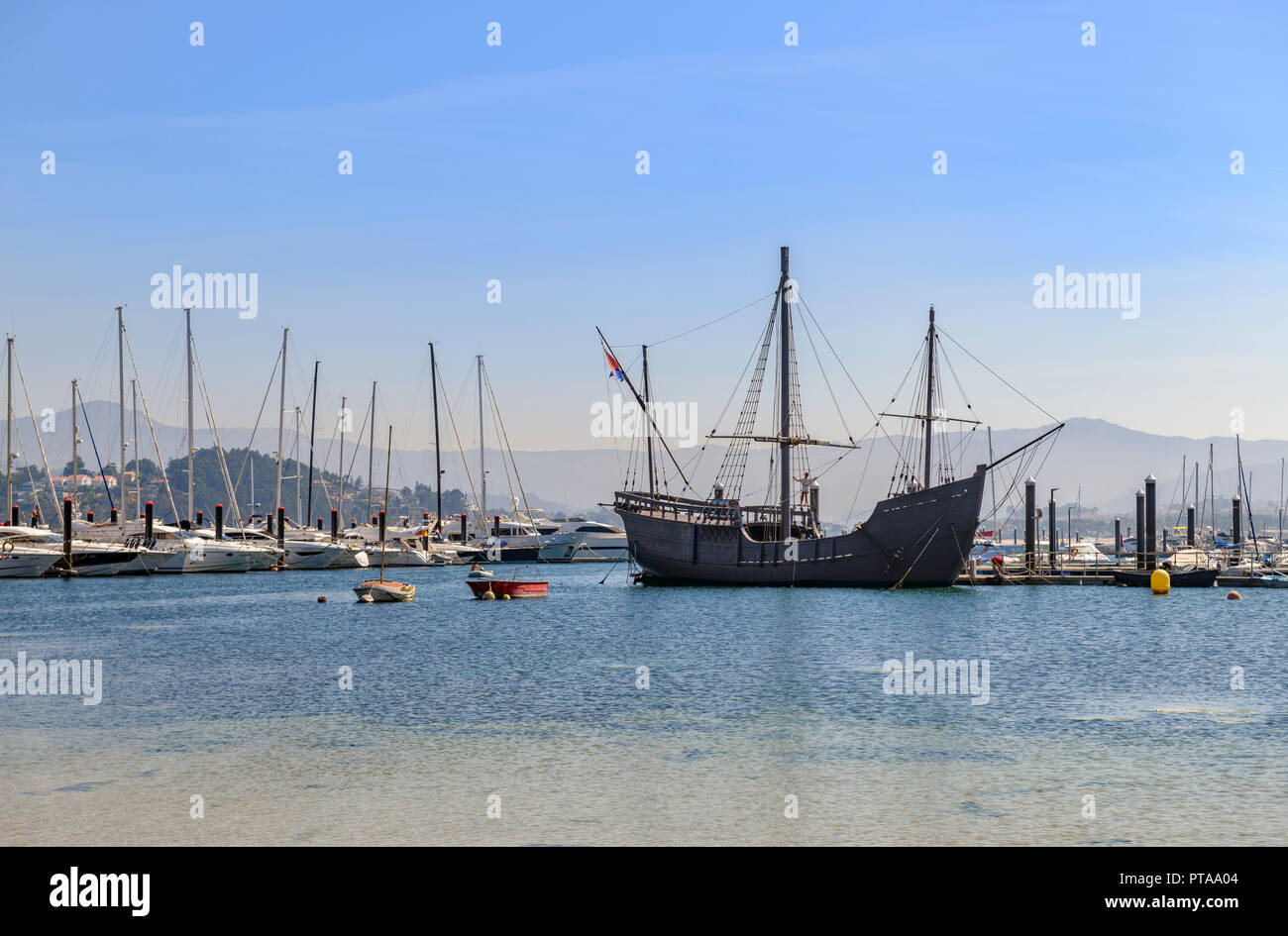 Bayona beach and marina with the replica ' La Pinta ' in the background Stock Photo