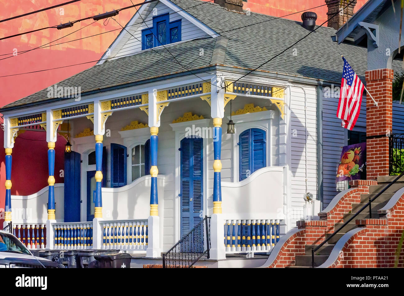 A blue and yellow color scheme accents a “double shotgun” house in the French Quarter, Nov. 15, 2015, in New Orleans, Louisiana. Stock Photo