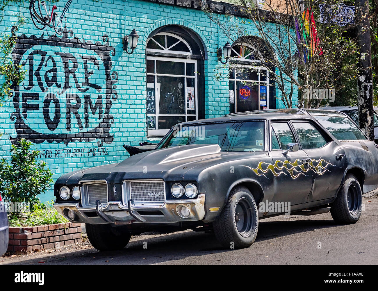 A wall mural and custompainted Vista Cruiser greets patrons of Rare
