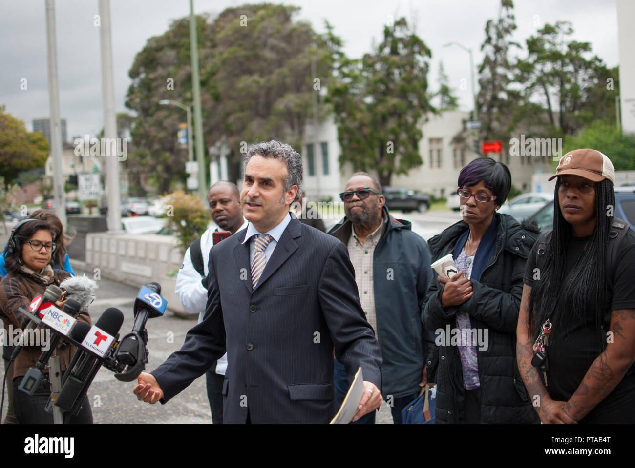 Attorney Ken Greenstein announces a lawsuit against the owners of a halfway house at 2551 San Pablo Ave., where a fire killed 4 people in March 2017. Stock Photo