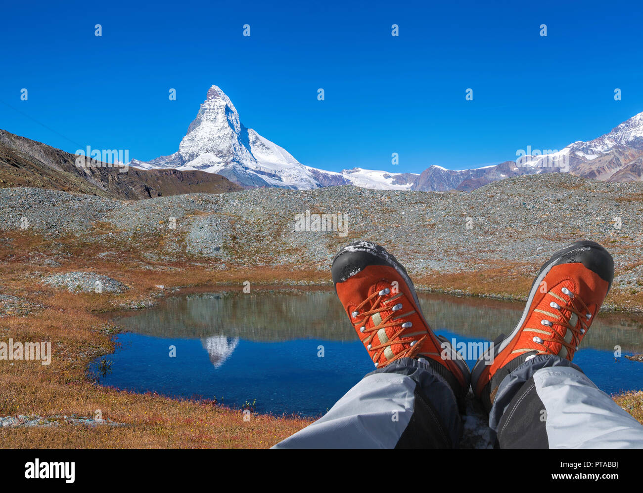 Matterhorn peak with hiking boots in Swiss Alps Stock Photo Alamy