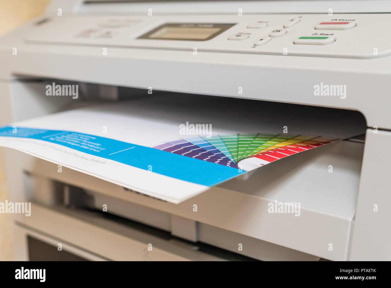 Printed sheet of paper comes out of printer Stock Photo Alamy