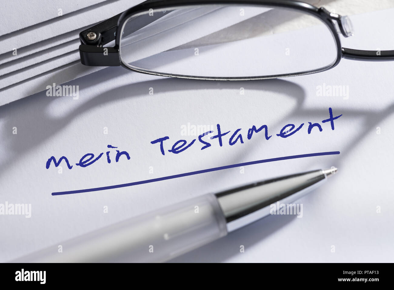 Testament with pen and glasses Stock Photo