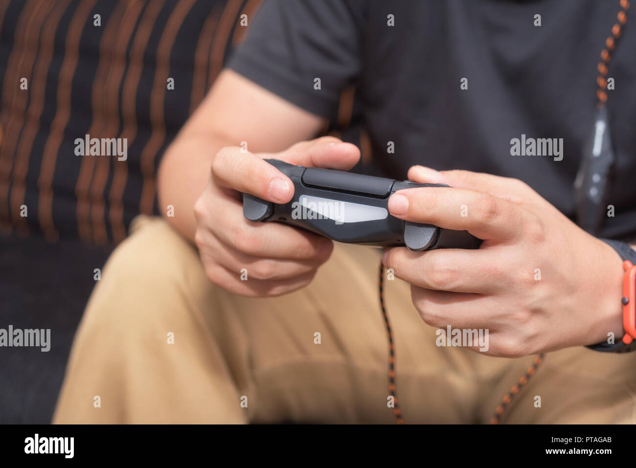 Young man playing video games Stock Photo