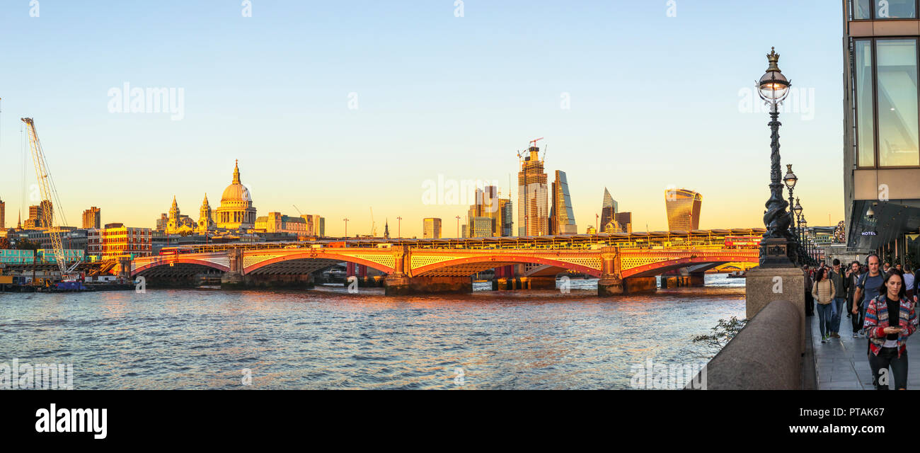 Panoramic skyline view of St Paul's Cathedral and the CIty of London skyscrapers over the River Thames and Blackfriars Bridge looking east Stock Photo