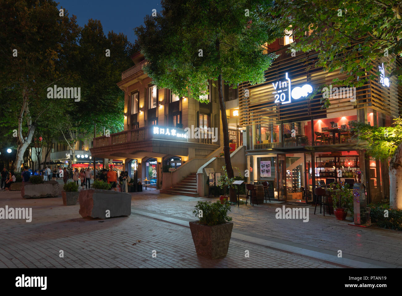4 October 2018, Wuhan China : Wuhan tiandi restaurants and shopping district street view at night with exterior of a wine bar in Hubei China Stock Photo