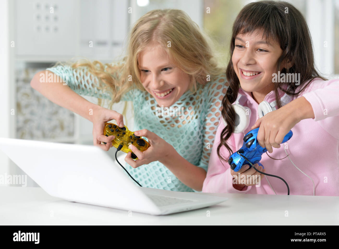 Portrait of little girl using modern laptop Stock Photo - Alamy