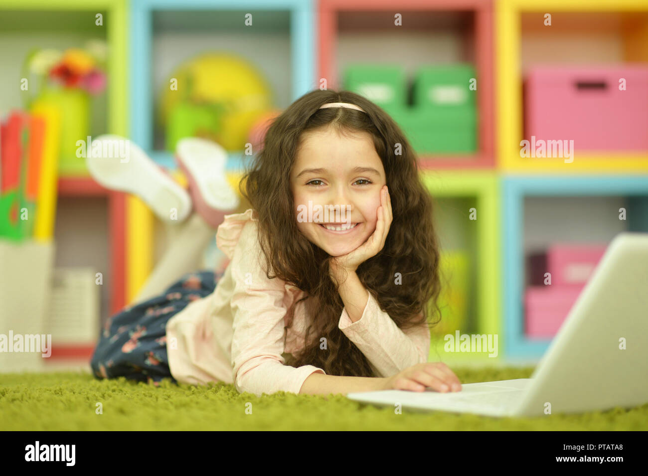 Portrait of emotional cute girl using laptop Stock Photo - Alamy