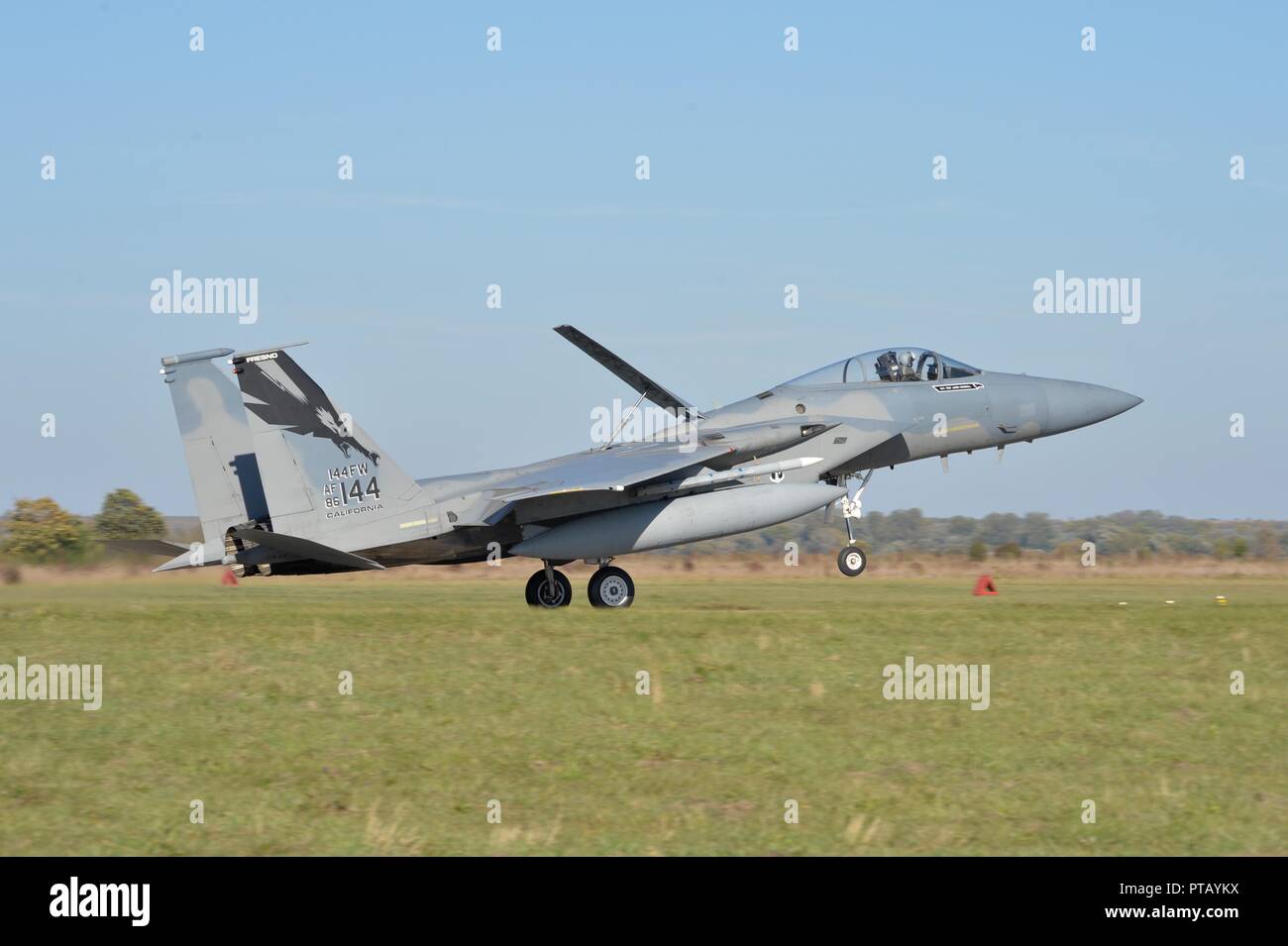 A U.S. Air Force F-15C Eagle fighter jet lands for the first time on Ukrainian soil during operation CLEAR SKY at Starokostiantyniv Air Base October 6, 2018 in Starokostiantyniv, Ukraine. The aircraft will participate in the largest NATO aviation exercise ever held in Ukraine. Stock Photo