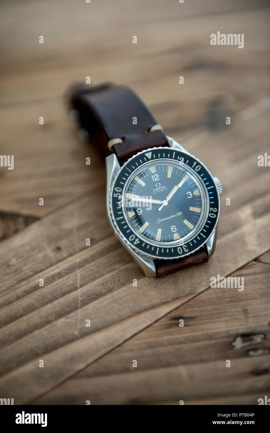 Omega Seamaster 300 or SM300 rare dive watch  from 1963 with  original bakelite bezel on a handmade leather strap Stock Photo - Alamy