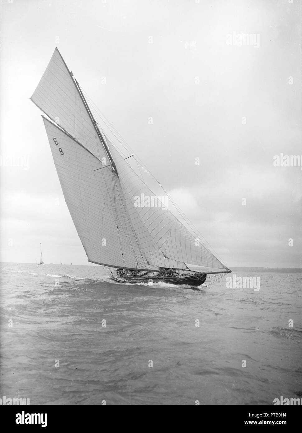 The 12 Metre sailing yacht 'Rollo' racing upwind, 1911. Creator: Kirk & Sons of Cowes. Stock Photo