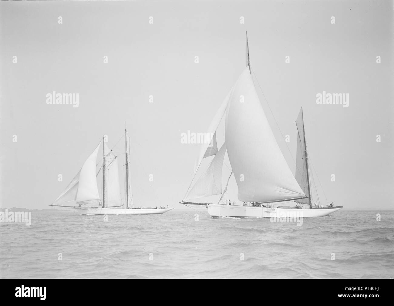 The ketch 'Cariad' and schooner 'Irma' racing downwind, 1911. Creator: Kirk & Sons of Cowes. Stock Photo