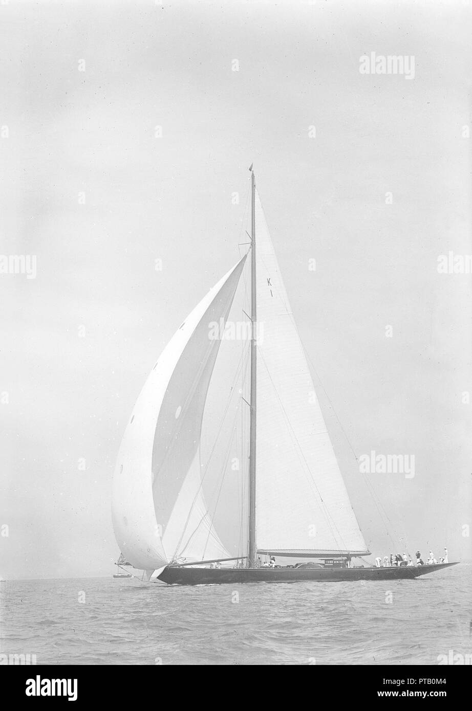 'Britannia' sails downwind under spinnaker, 1935. Creator: Kirk & Sons of Cowes. Stock Photo