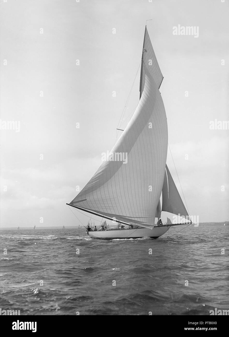 The 15-metre cutter 'Ostara' sailing downwind, 1911. Creator: Kirk & Sons of Cowes. Stock Photo