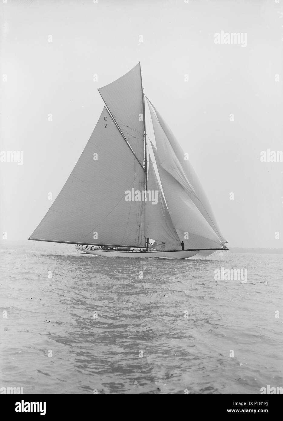 The 19-metre class 'Mariquita' sailing downwind, 1913.  Creator: Kirk & Sons of Cowes. Stock Photo