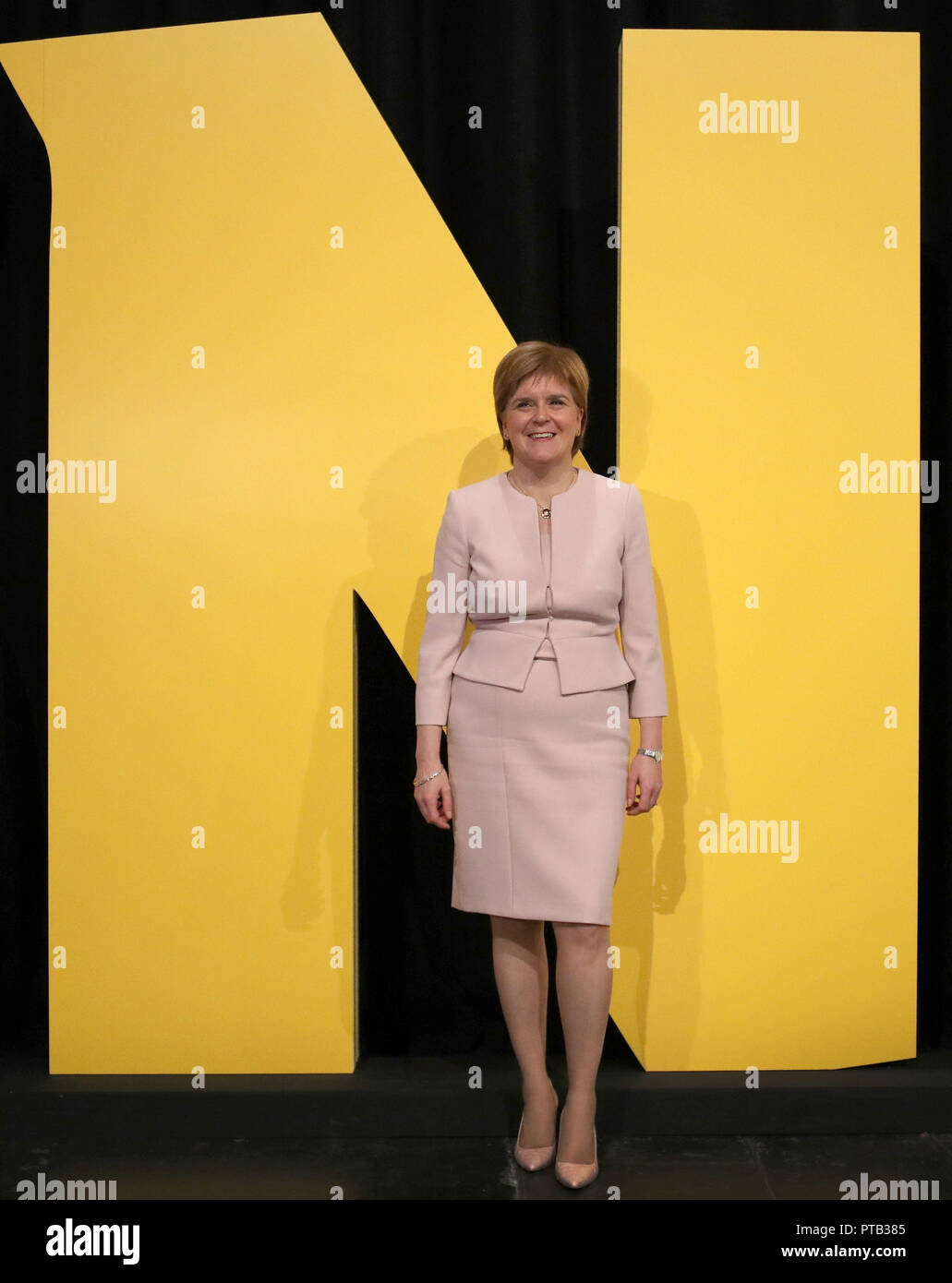 First Minister Nicola Sturgeon poses by the letter N during day two of the SNP autumn conference at the SEC, Glasgow. Stock Photo