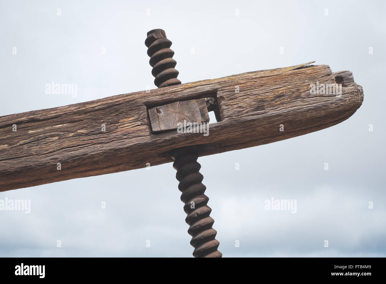 old wooden tool, part of old grapewine press , winery  - Stock Photo