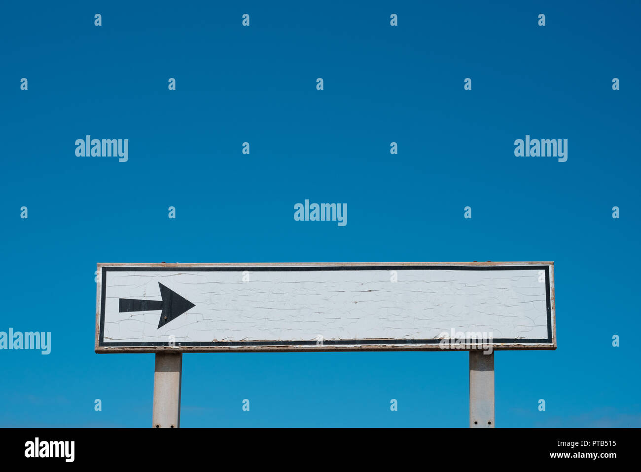 Empty white sign isolated on blue sky - Stock Photo