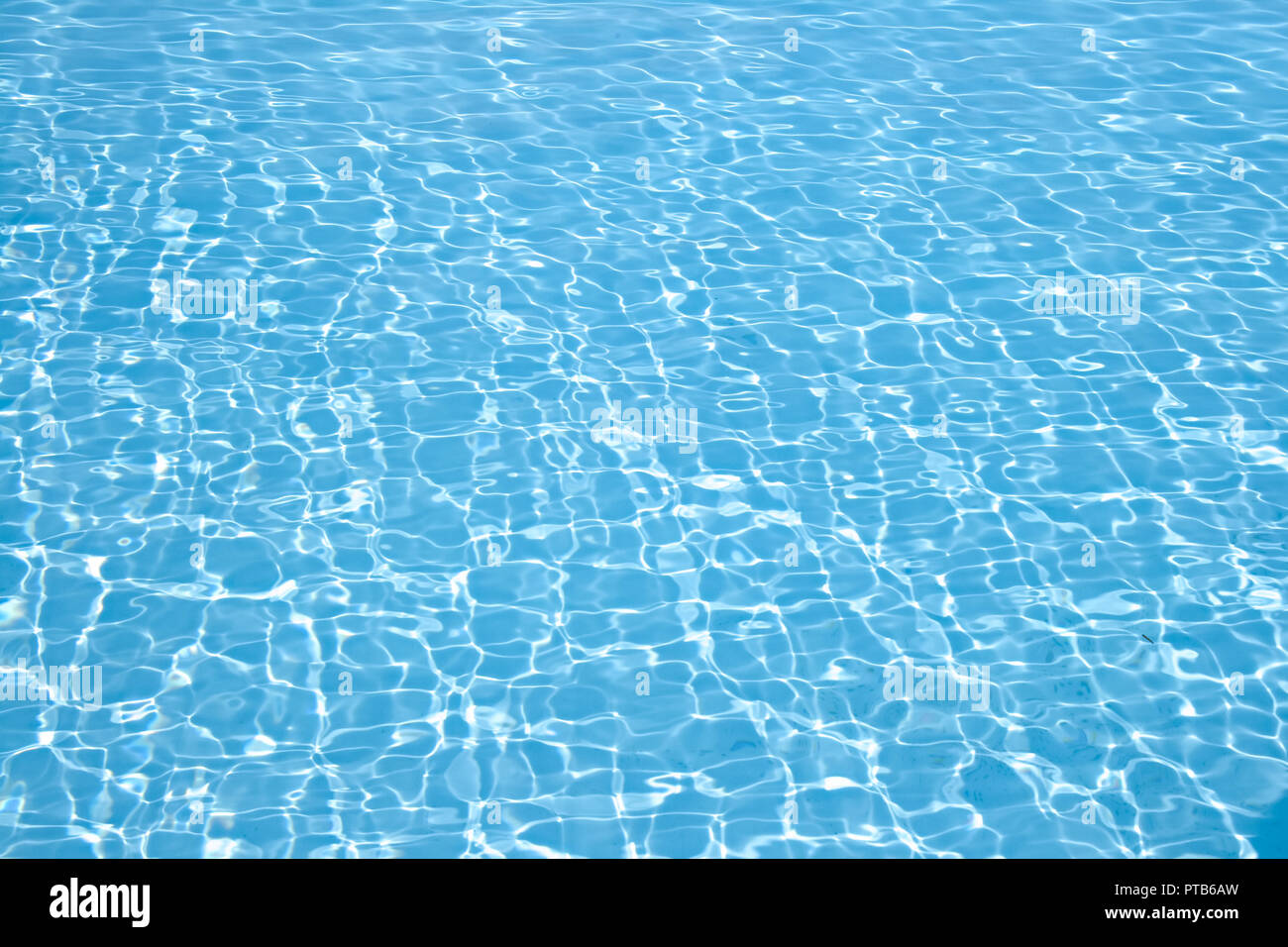Wonderful crystal light blue clear water of a swimming pool Stock Photo