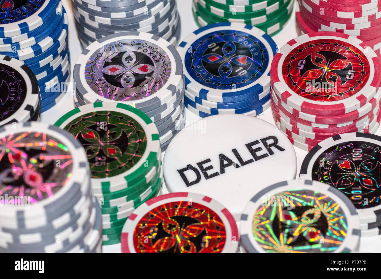 Gaming poker chips with Dealer chips in the center Stock Photo