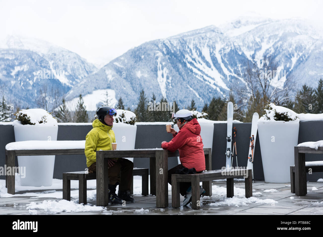 Senior couple interacting while having coffee Stock Photo