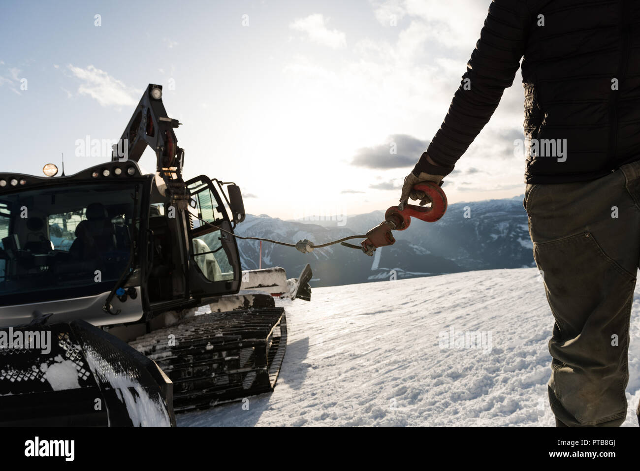 Man holding snowplow hook during winter Stock Photo