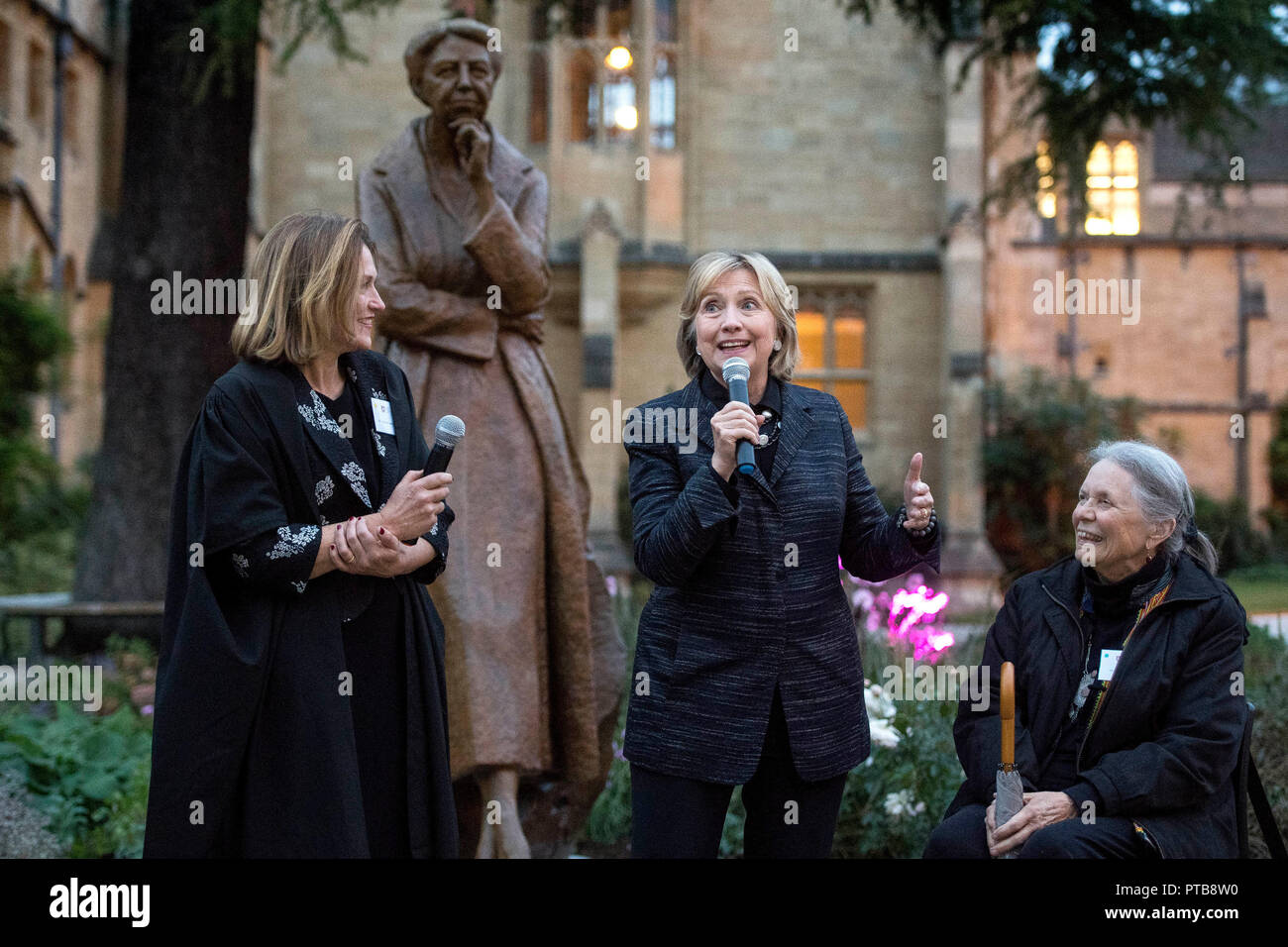 The statue of Eleanor Roosevelt is unveiled by Hillary Rodham Clinton (centre) with Helen Mountfield, Principle of Mansfield College, and Penelope Jencks, the artist that created the statue outside the Bonavero Institute in Oxford on the 70th anniversary of the Universal Declaration of Human Rights. Stock Photo