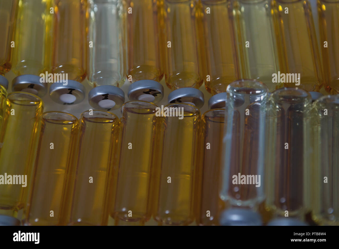 Arranged sample bottle in laboratory Stock Photo