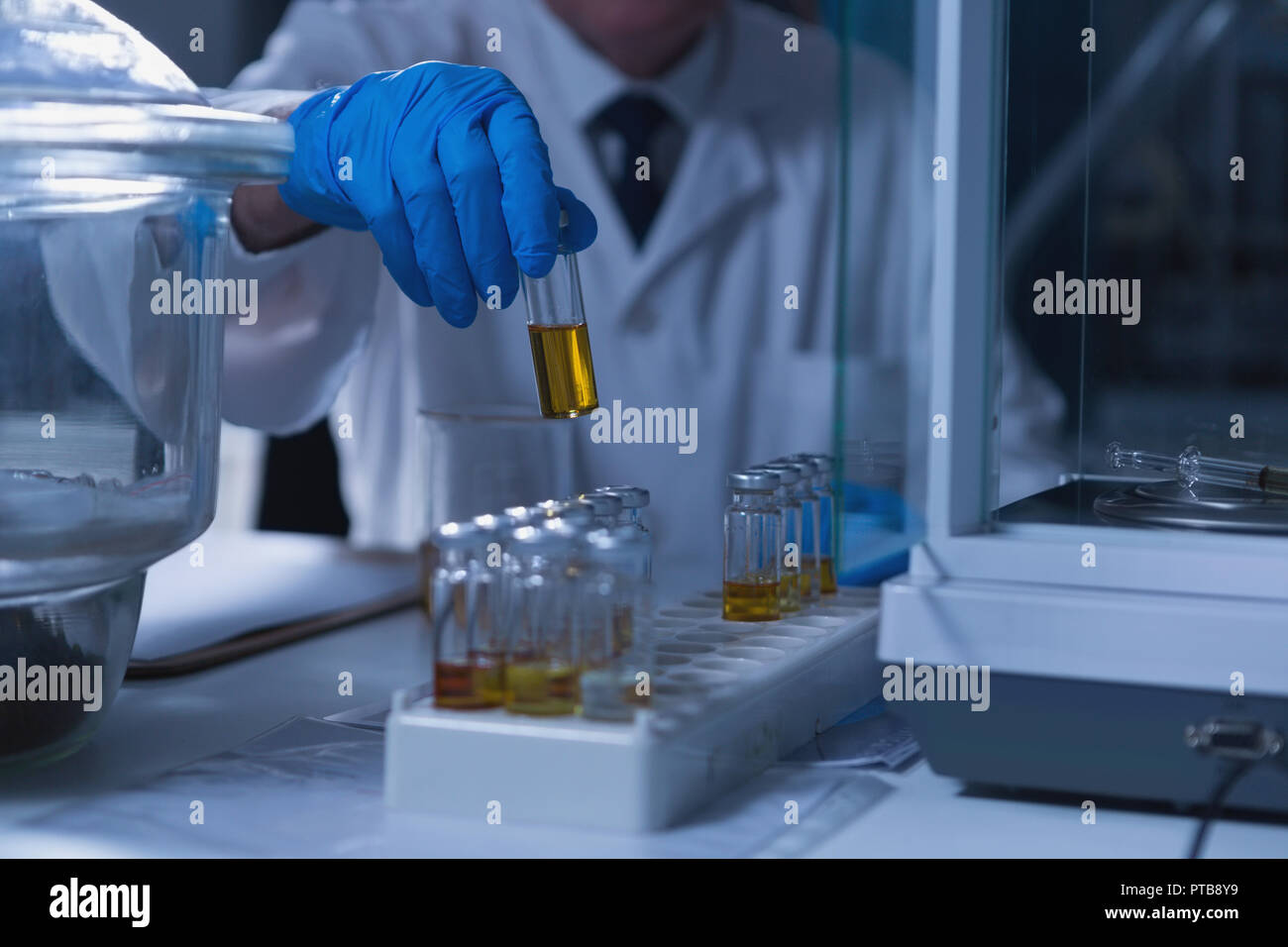 Male scientist experimenting in laboratory Stock Photo