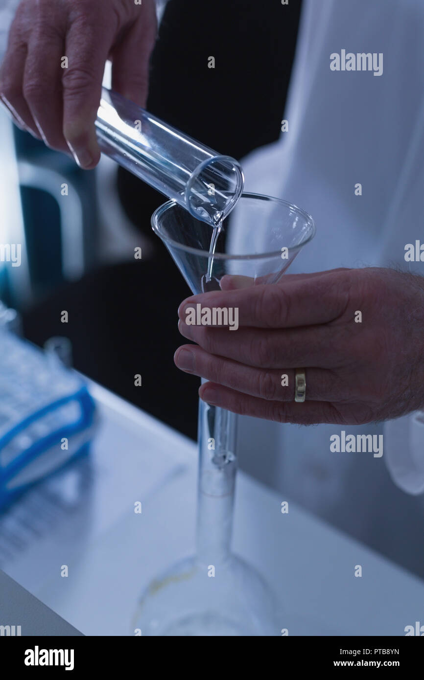 Male scientist experimenting in laboratory Stock Photo