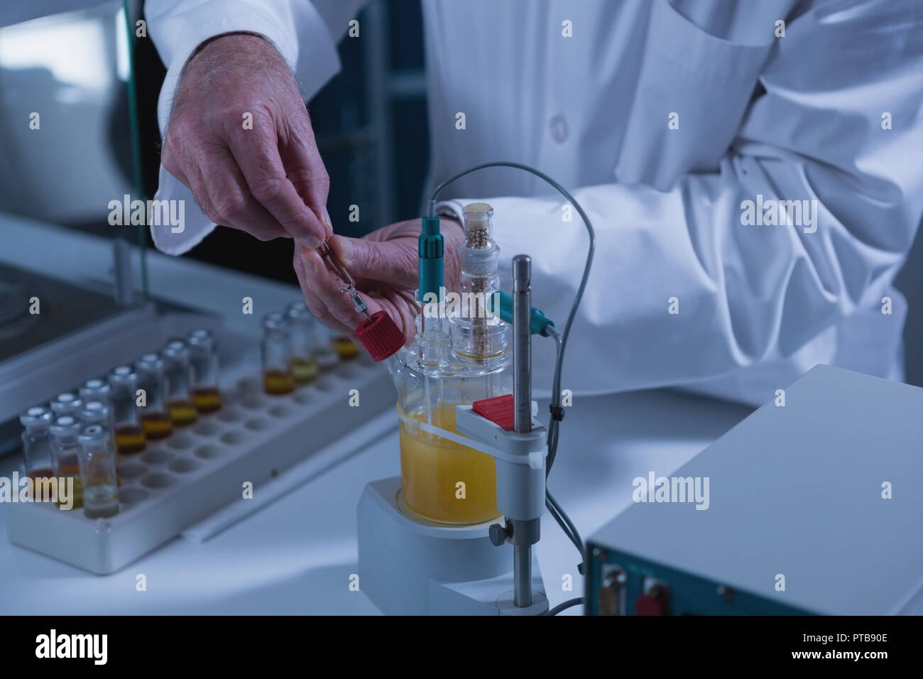 Male scientist experimenting in laboratory Stock Photo