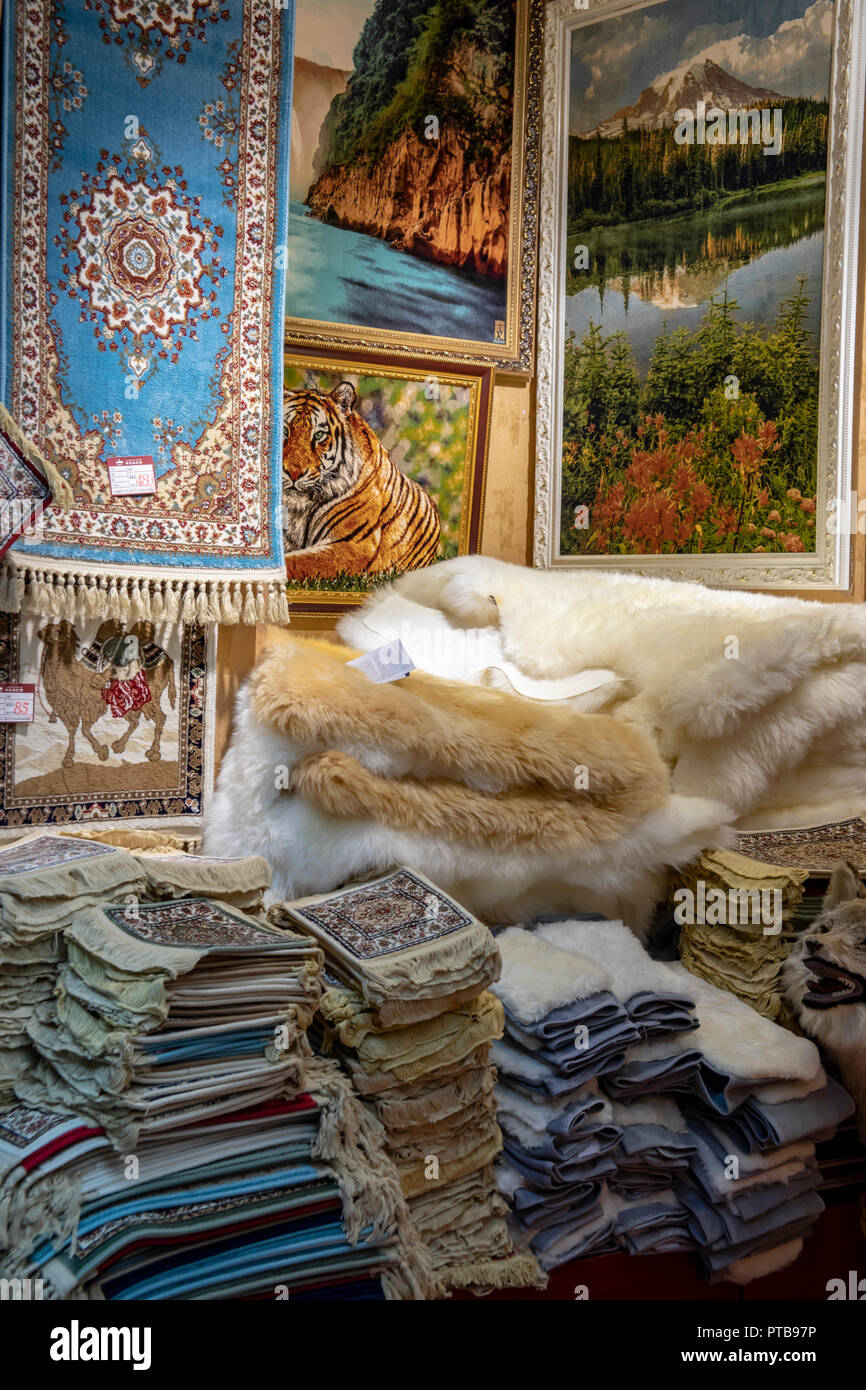 Rugs for sale in shop of Grand Bazaar in Urumchi, Xinjiang Autonomous Region, China. Stock Photo
