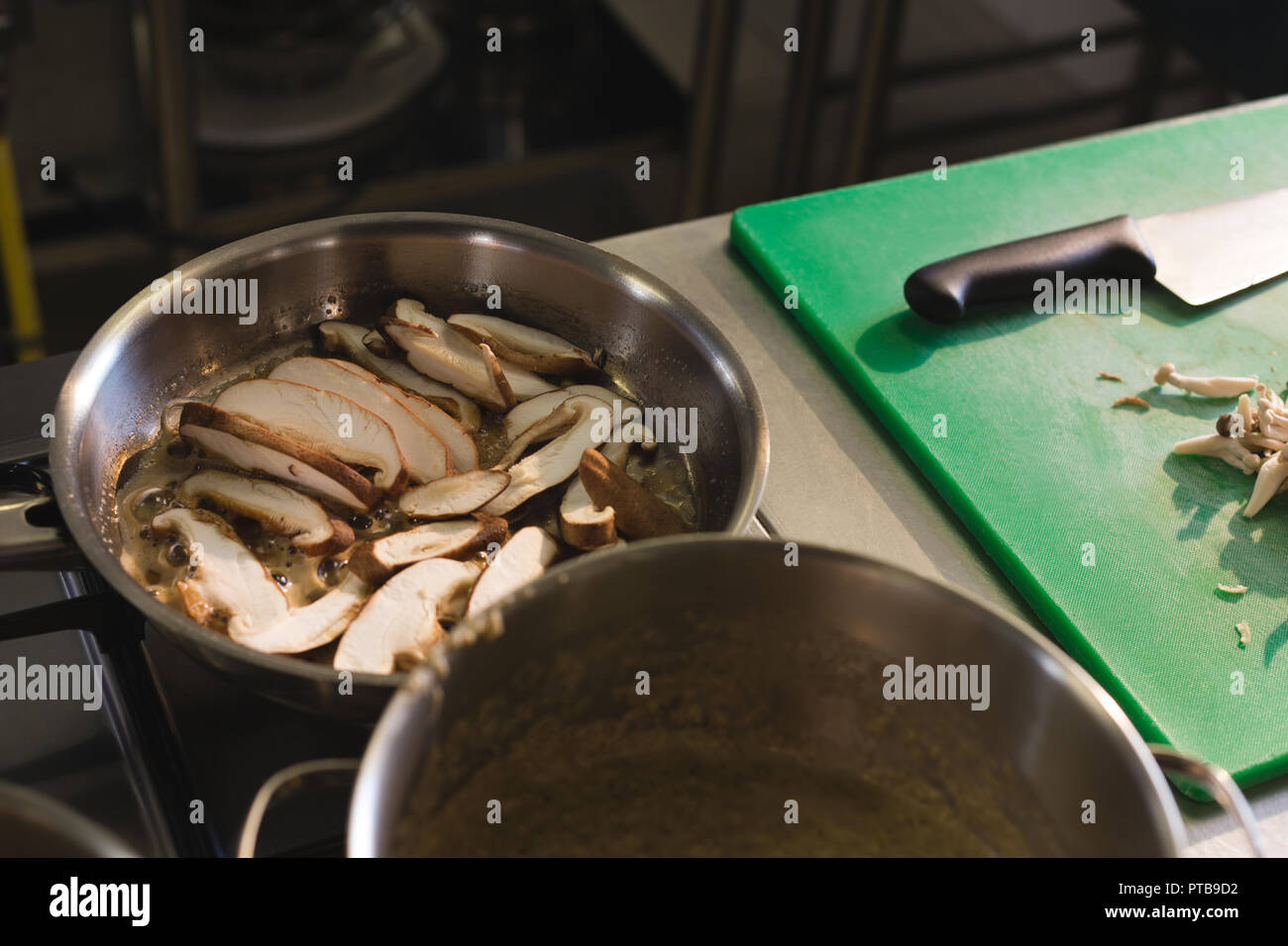 Mushroom in a bowl on gas stove Stock Photo