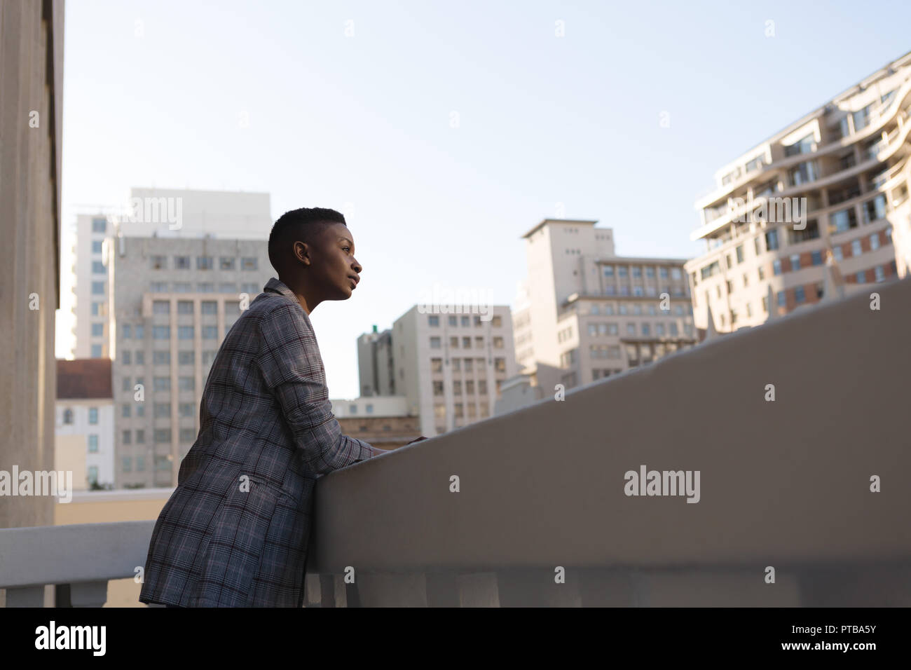 Businesswoman standing in the balcony of office Stock Photo