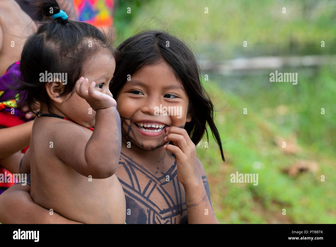 Central America, Panama, Gatun Lake. Embera Indian village. Typical happy village children with tattoos. Stock Photo